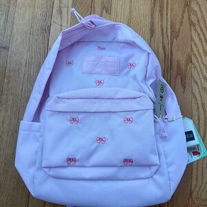 Jansport Superbreak Plus FX pink backpack with embroidered bows
